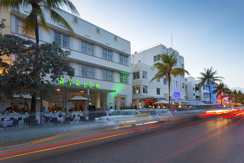 Ocean Drive restaurants and Art Deco architecture at dusk, South Beach, Miami Beach, Miami, Florida, United States of America, North America