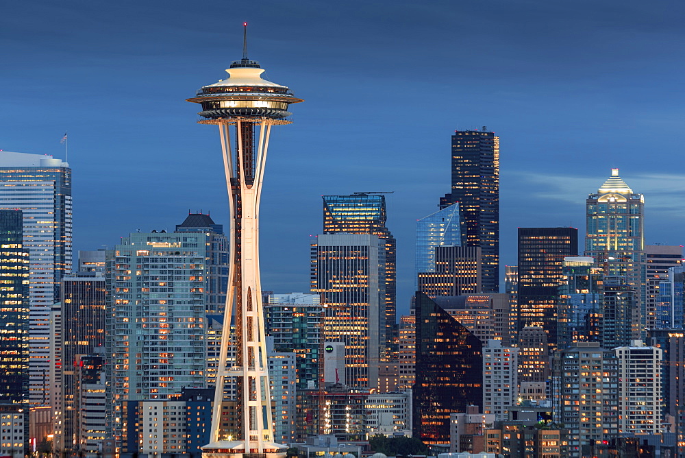 Seattle city skyline at night with illuminated office buildings and Space Needle viewed from public garden near Kerry Park, Seattle, Washington State, United States of America, North America