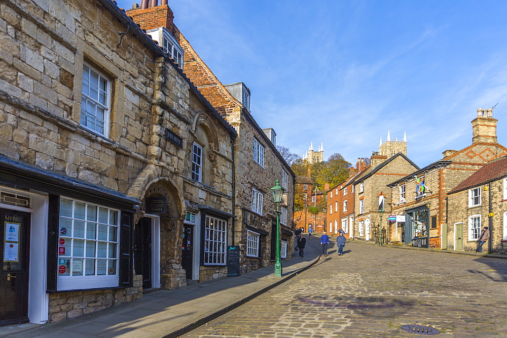 Lincoln Cathedral viewed from the cobbled Steep Hill, Lincoln, Lincolnshire, England, United Kingdom, Europe