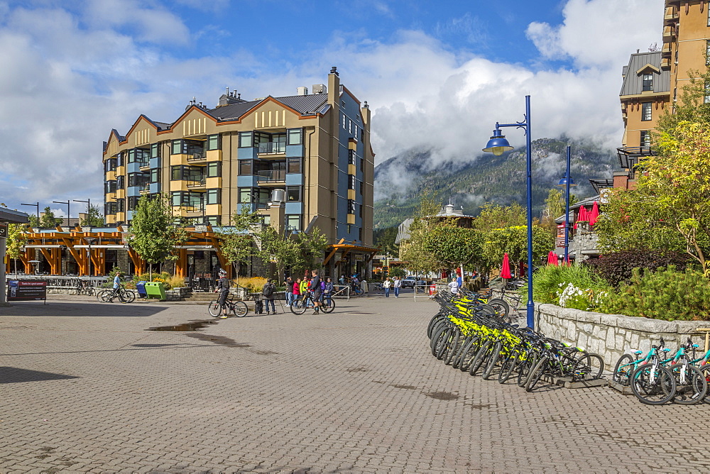 Cycles and shops aligning Skiers Plaza, Whistler Village, British Columbia, Canada, North America