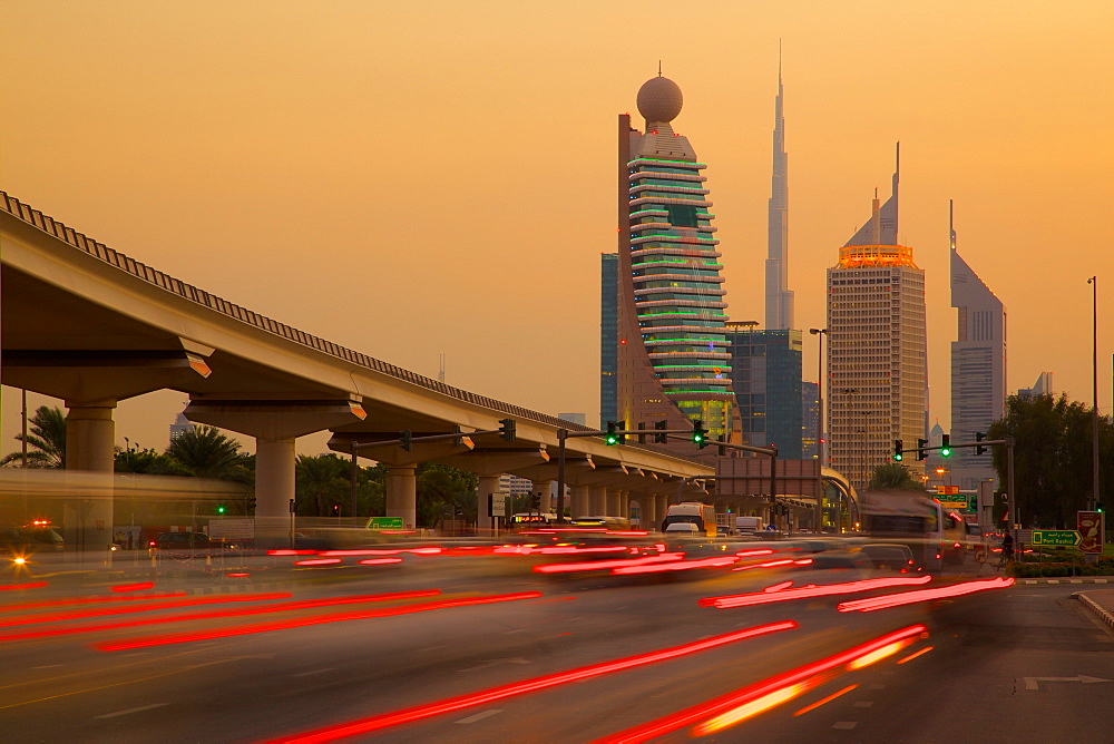 City skyline and car trail lights at sunset, Dubai, United Arab Emirates, Middle East