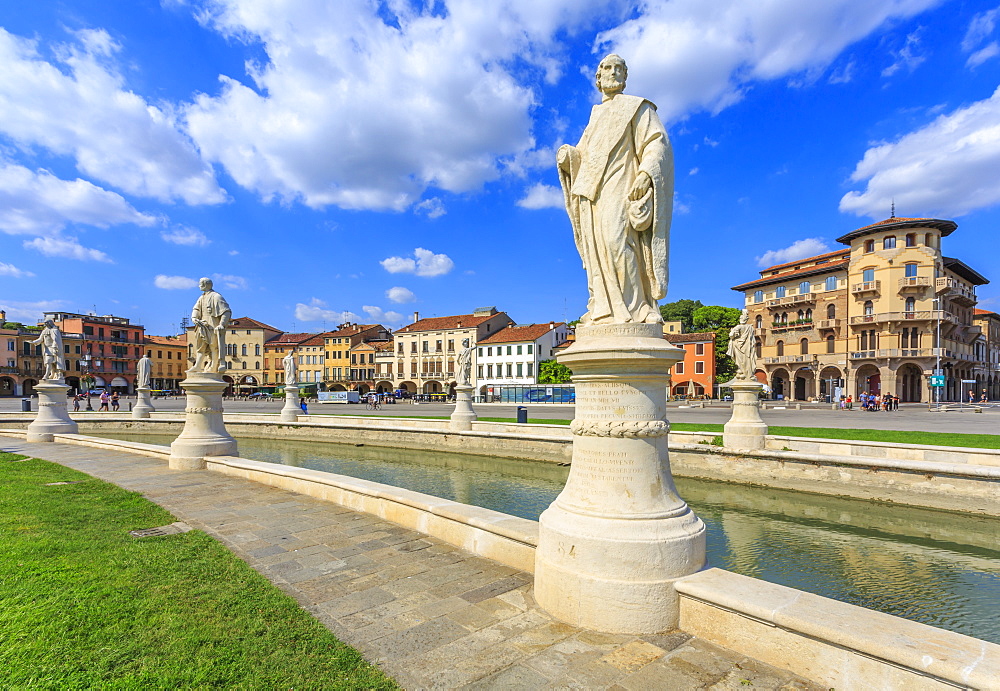 View of statues in Prato della Valle and colourful architecture  in the background, Padua, Veneto, Italy, Europe