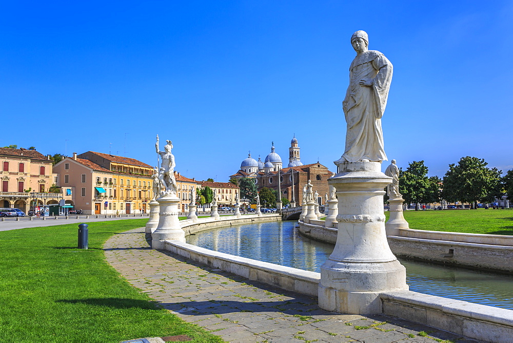 View of statues in Prato della Valle and Santa Giustina Basilica visible in background, Padua, Veneto, Italy, Europe