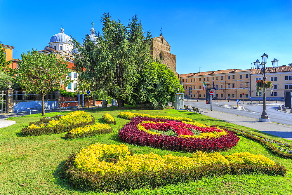 View of gardens in Prato della Valle and Santa Giustina Basilica visible in background, Padua, Veneto, Italy, Europe