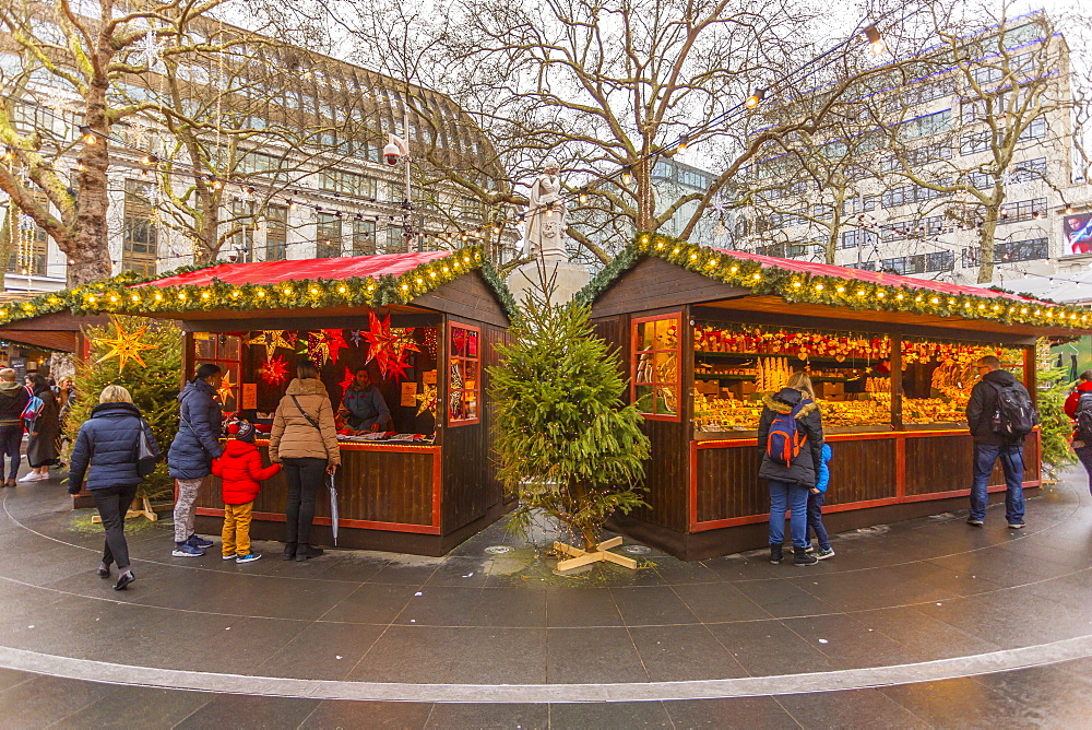 Christmas Market Stalls and William Shakespeare Fountain in Leicester Square, London, England, United Kingdom, Europe