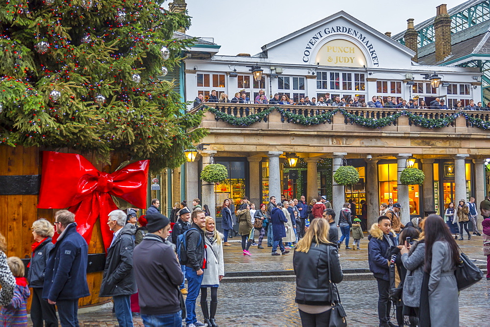 Visitors and Christmas decorations in Covent Garden Market, London, England, United Kingdom, Europe