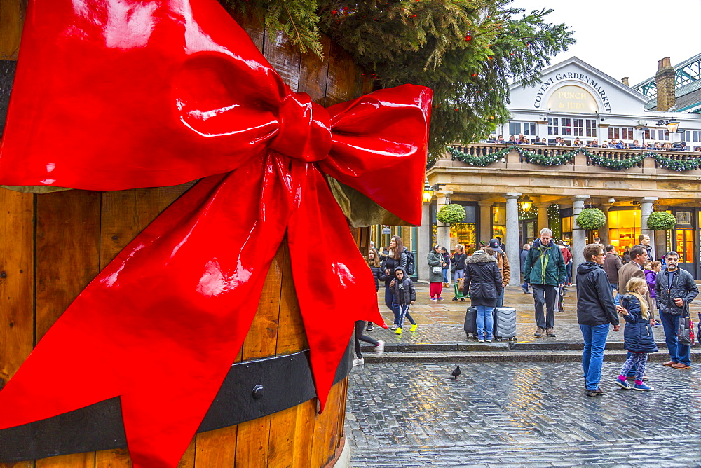 Visitors and Christmas decorations in Covent Garden Market, London, England, United Kingdom, Europe