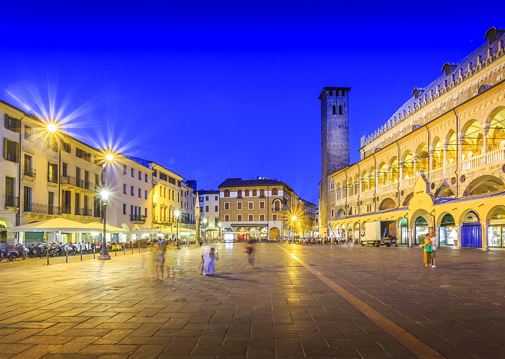 Cafes and Tower of Anziani in Piazza della Frutta at dusk, Ragione Palace is visible, Padua, Veneto, Italy, Europe