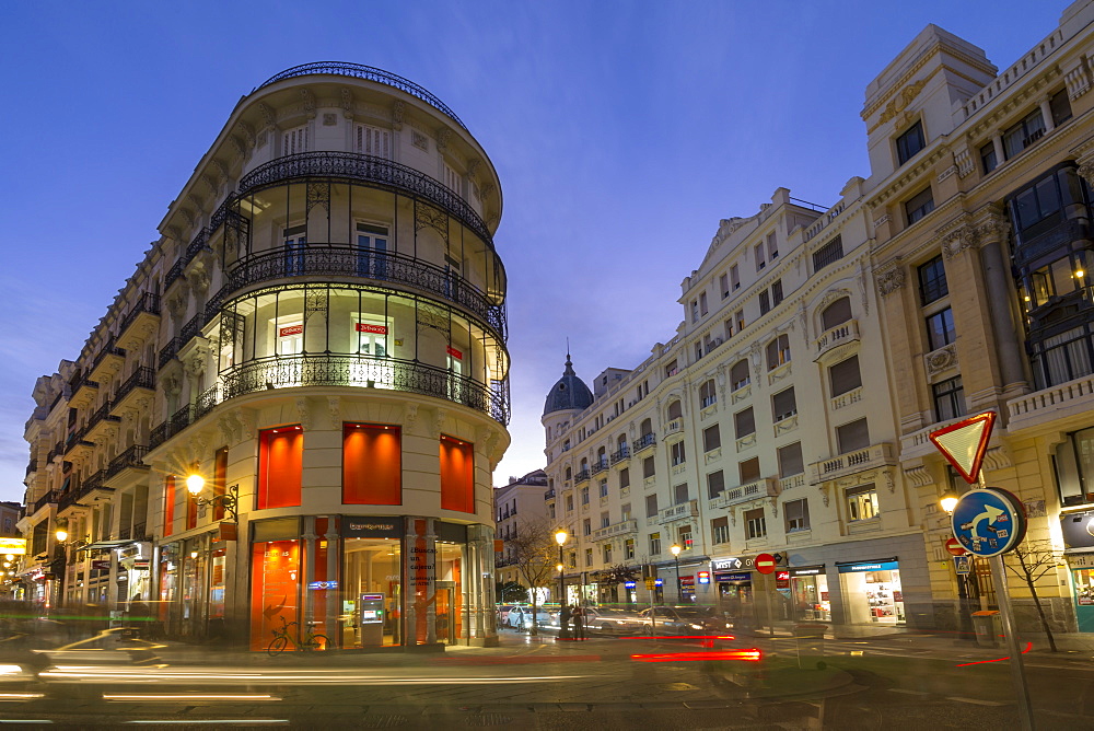 View of architecture on and around Calle Mayor and Calle Postas at dusk, Madrid, Spain, Europe