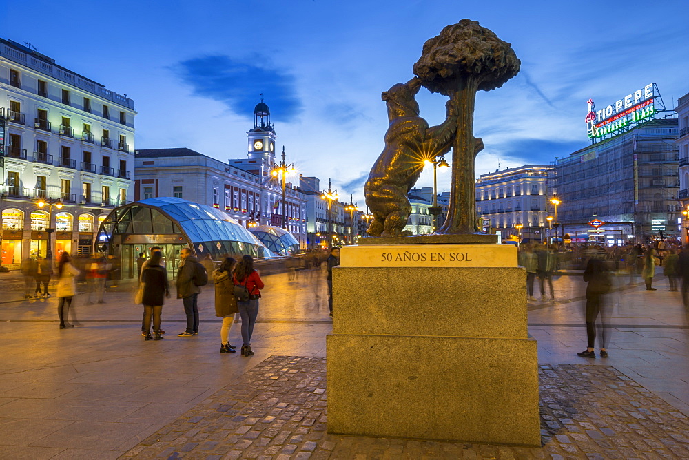 View of Bear and Strawberry Tree statue and Puerta Del Sol at dusk, Madrid, Spain, Europe