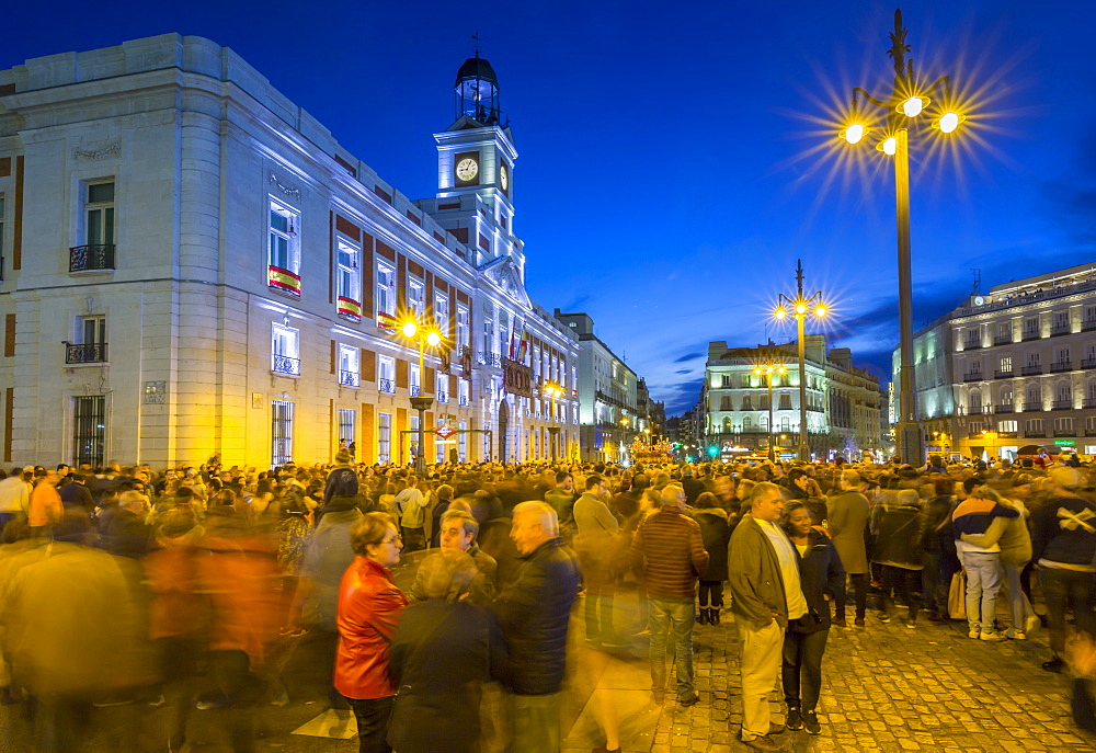 View of Real Casa de Correos and Easter Parade in Puerta del Sol at dusk, Madrid, Spain, Europe