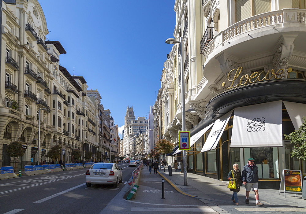 View of shops and traffic on Gran Via, Madrid, Spain, Europe