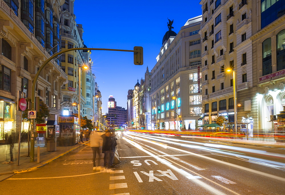 View of architecture and trail lights on Gran Via at dusk, Madrid, Spain, Europe