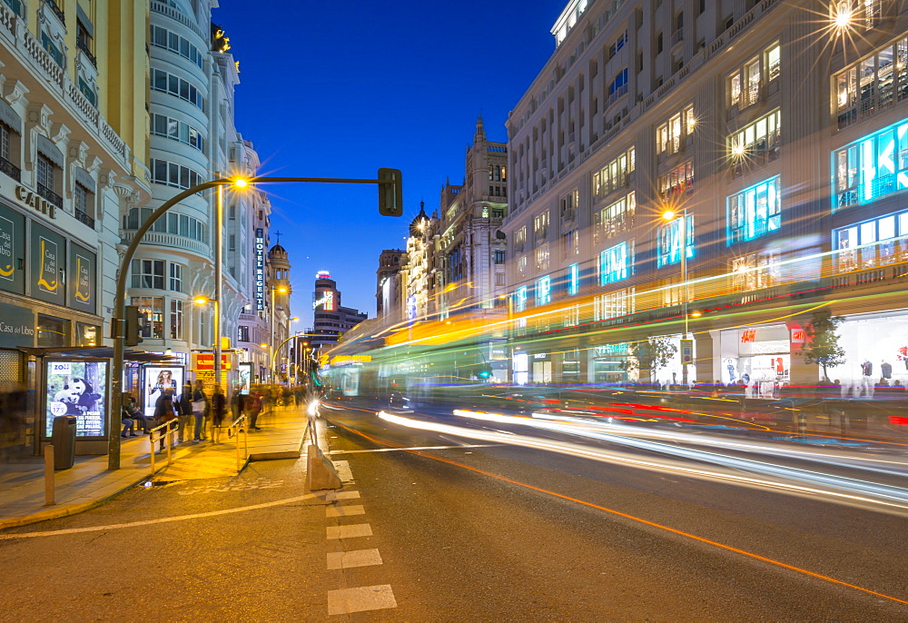 View of architecture and trail lights on Gran Via at dusk, Madrid, Spain, Europe