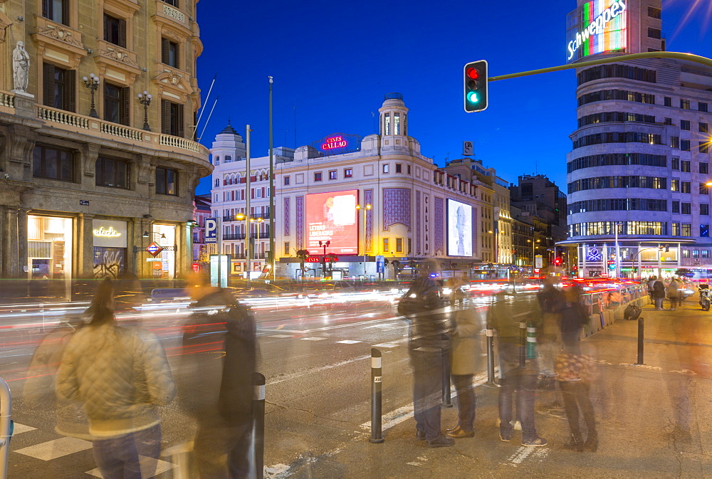 View of architecture and trail lights on Gran Via and Plaza del Calao at dusk, Madrid, Spain, Europe