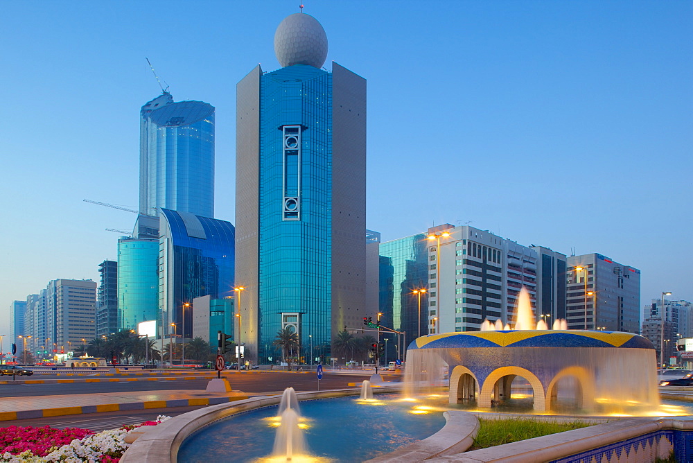 City skyline on Rashid Bin Saeed Al Maktoum Street at dusk, Abu Dhabi, United Arab Emirates, Middle East 