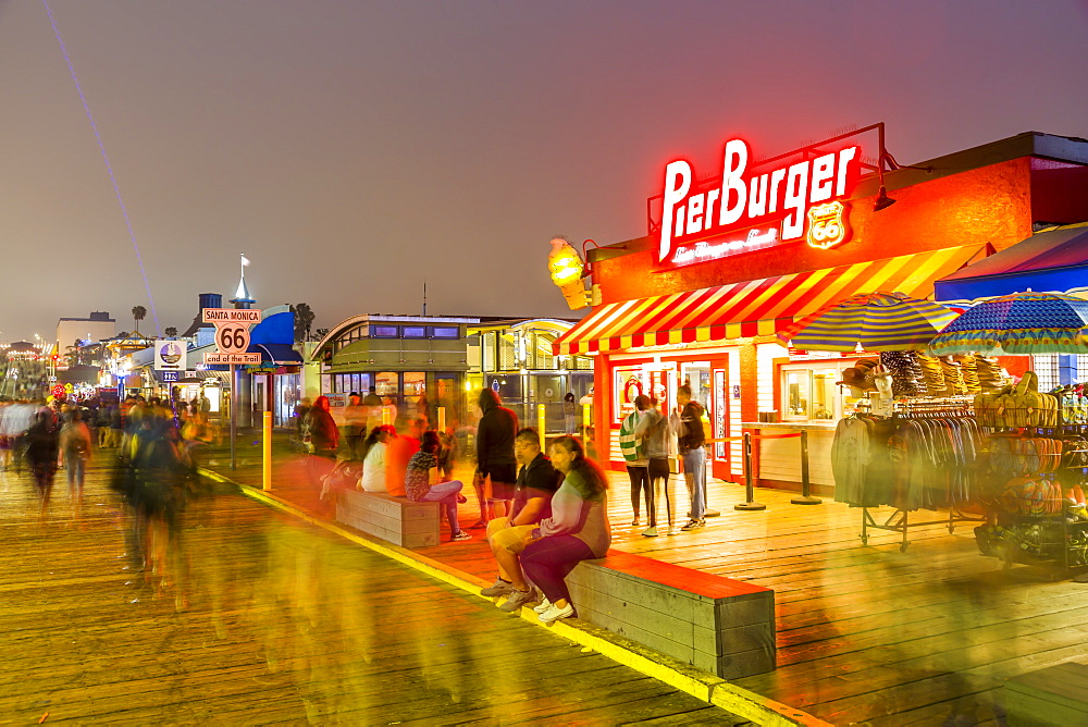 View of shops and Route 66 End of Trail sign on Santa Monica Pier, Santa Monica, Los Angeles, California, United States of America, North America