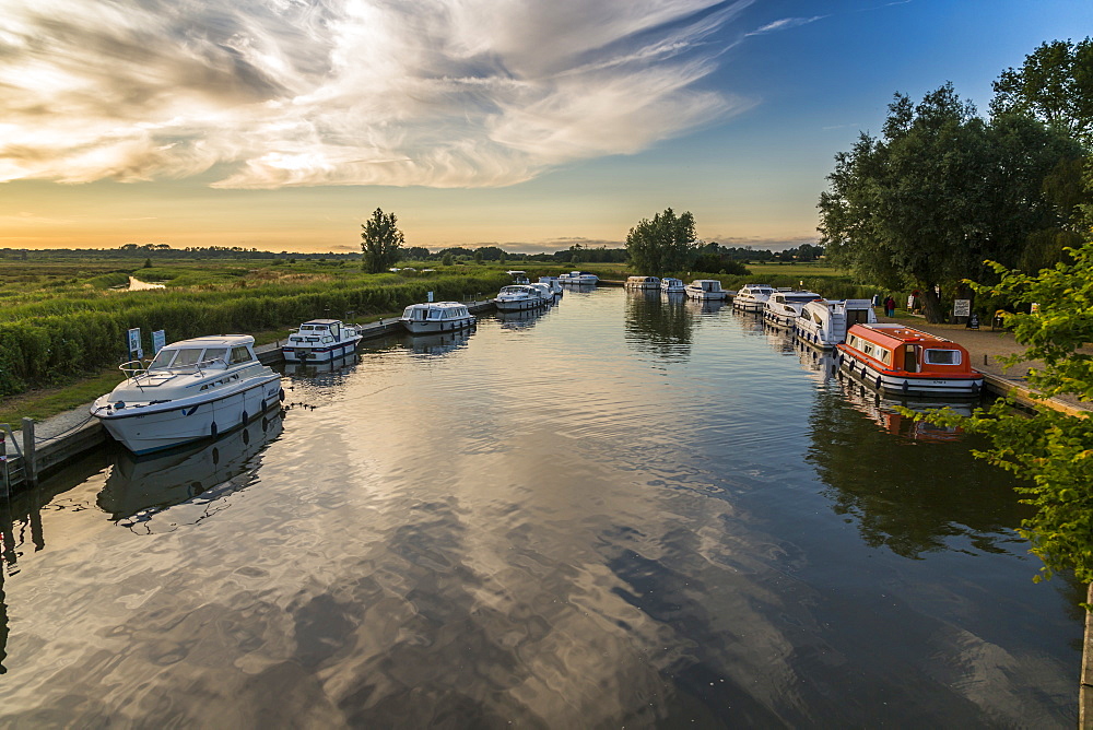 Boats and cottage near Horsey Mill at sunset, Norfolk Broads, Norfolk, England, United Kingdom, Europe