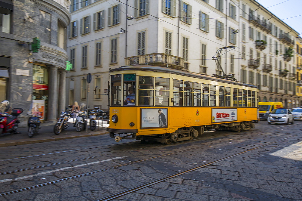 City tram passing on Via Alessandro Manzoni, Milan, Lombardy, Italy, Europe