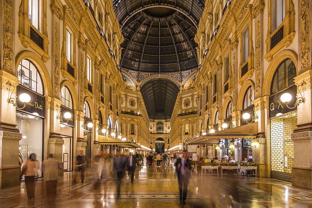 View of the interior of Galleria Vittorio Emanuele II illuminated at dusk, Milan, Lombardy, Italy, Europe