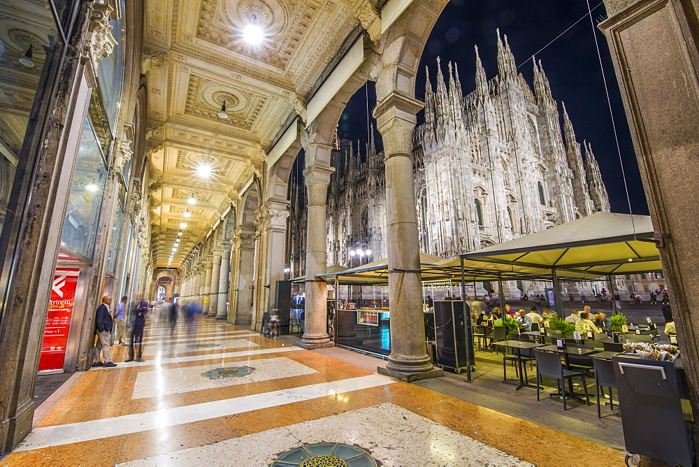 View of Duomo di Milano illuminated at dusk from Galleria Vittorio Emanuele II in Piazza Del Duomo at dusk, Milan, Lombardy, Italy, Europe