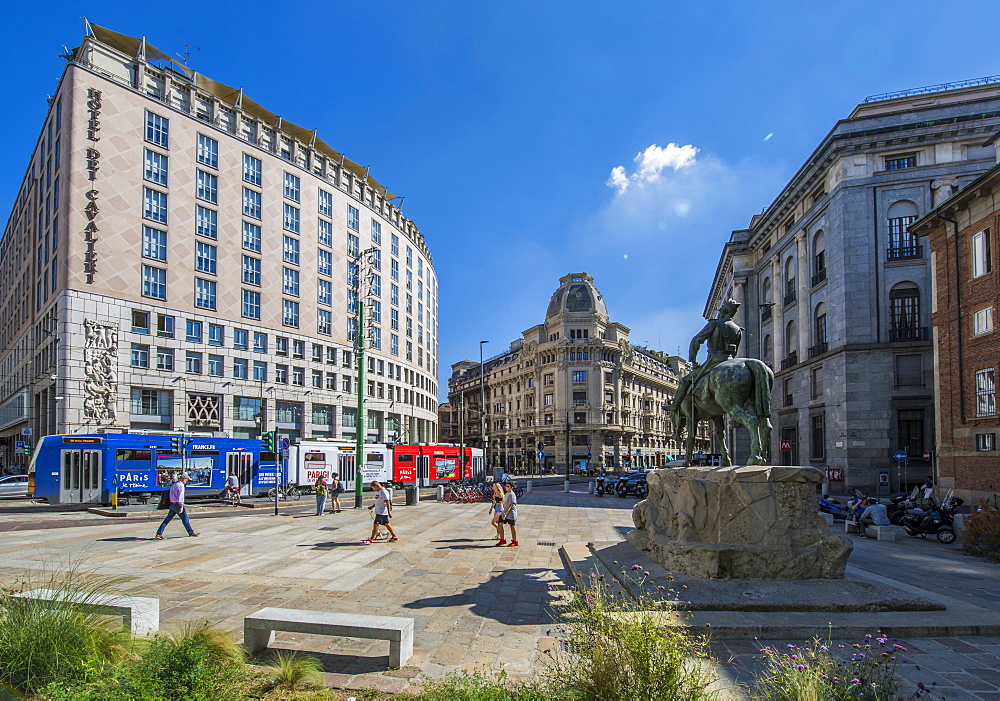 City tram and statue in Piazza Giuseppe Missori, Milan, Lombardy, Italy, Europe