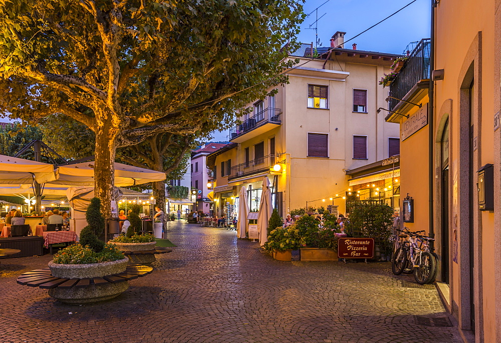 View of restaurants and souvenir shops in Stresa at dusk, Lago Maggiore, Piedmont, Italian Lakes, Italy, Europe