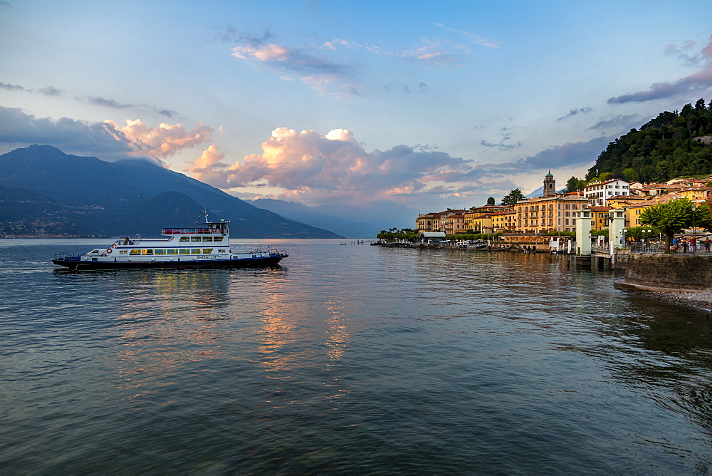 View of Lake Como and ferry arriving at Bellagio at sunset, Province of Como, Lake Como, Lombardy, Italian Lakes, Italy, Europe