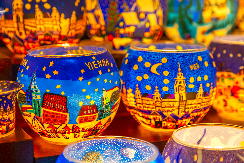 Christmas decorations on Christmas market stall at night in Rathausplaza, Vienna, Austria, Europe