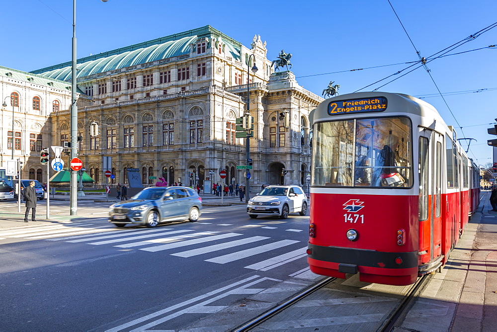 View of Royal Opera House and city tram on Opernring, Vienna, Austria, Europe