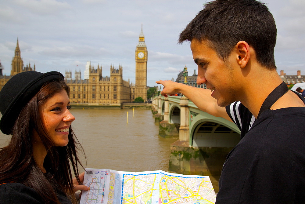 Big Ben and young couple looking at map, London, England, United Kingdom, Europe