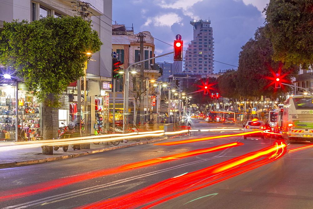 View of Isrotel Tower and trail lights at dusk, Tel Aviv, Israel, Middle East