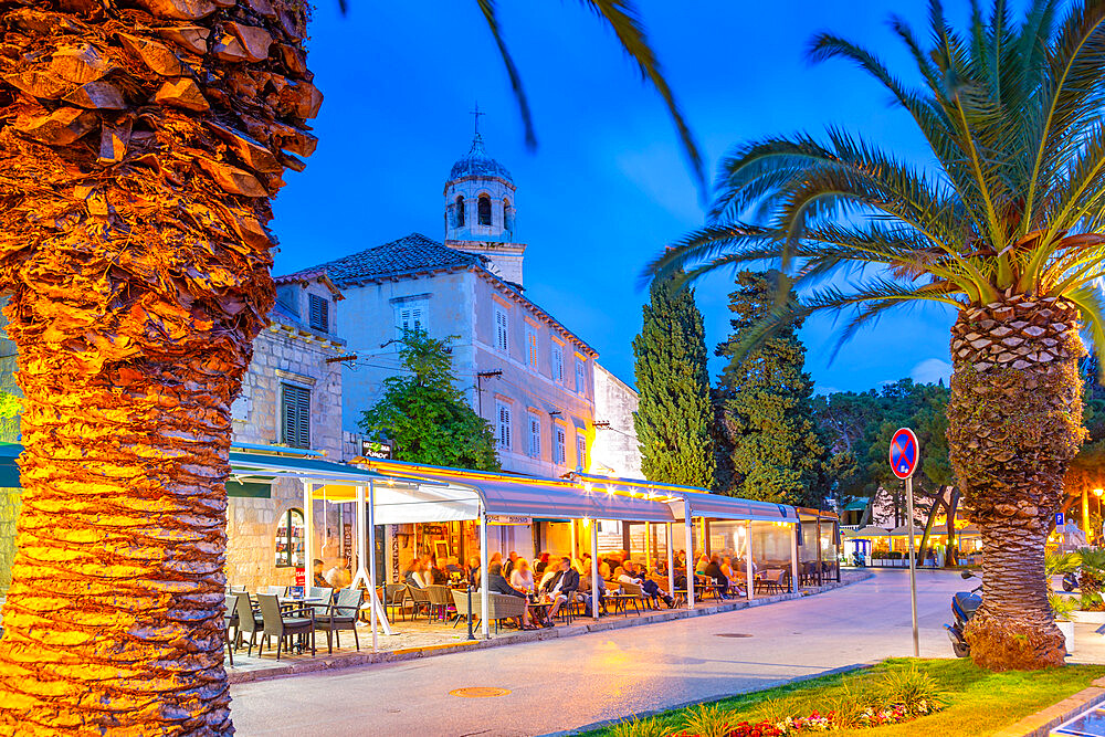 View of restaurants and church at dusk, Cavtat on the Adriatic Sea, Cavtat, Dubrovnik Riviera, Croatia, Europe