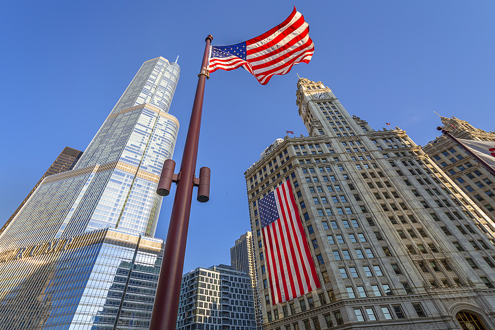 Early morning view of The Wrigley Building and Stars and Stripes US flag on DuSable Bridge, Chicago, Illinois, United States of America, North America