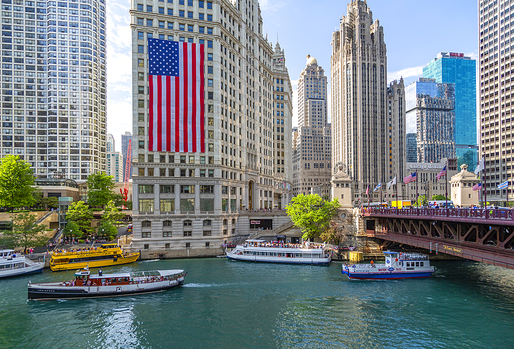 View of American flag on the Wrigley Building and Chicago River, Chicago, Illinois, United States of America, North America