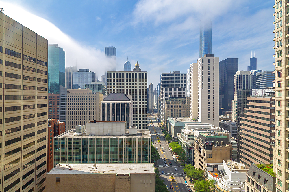 View of Chicago skyline from hotel window on Michigan Avenue at dusk, Chicago, Illinois, United States of America, North America