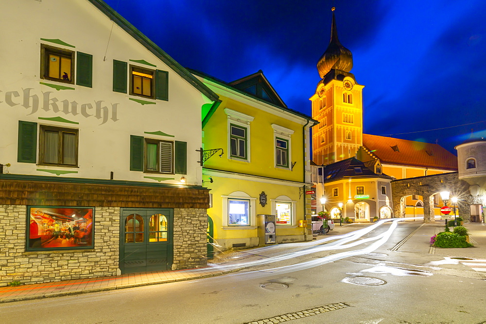 View of church and local buildings at dusk, Schladming, Styria, Austrian Tyrol, Austria, Europe