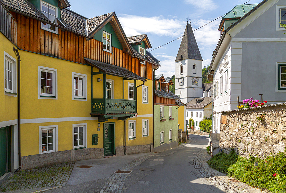 View of colourful buildings and church in Bad Aussie, Styria, Austria, Europe