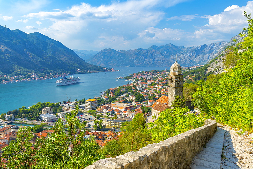 View of cruise ship and Chapel of Our Lady of Salvation overlooking the Old Town, UNESCO World Heritage Site, Kotor, Montenegro, Europe