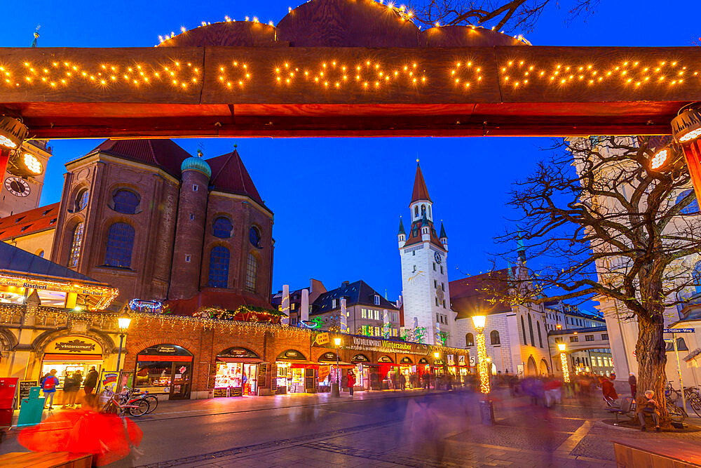 View of Old Town Hall and entrance to Viktualienmarkt Christmas Market at dusk, Munich, Bavaria, Germany, Europe