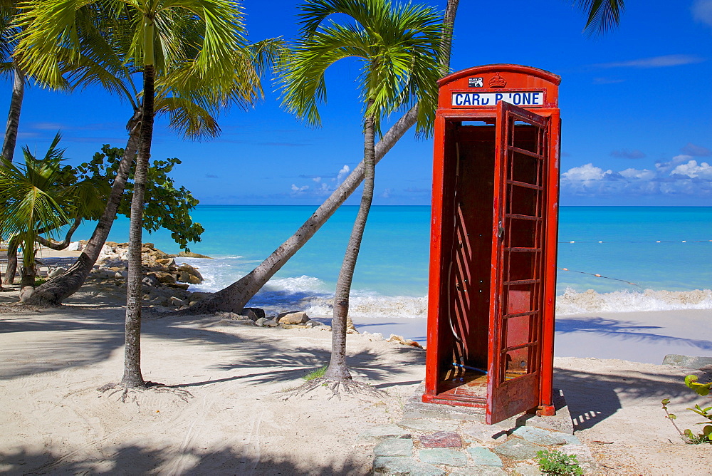 Beach and red telephone box, Dickenson Bay, St. Georges, Antigua, Leeward Islands, West Indies, Caribbean, Central America