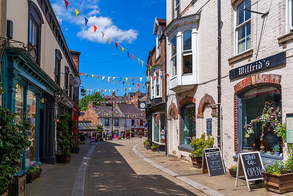 View of shops and cafes on Kirkgate, Ripon, North Yorkshire, England, United Kingdom, Europe