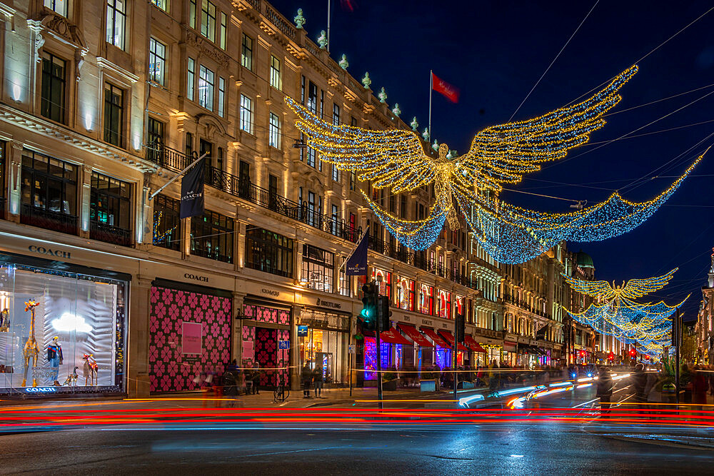 View of Christmas lights and shops on Regent Street at Christmas, London, England, United Kingdom, Europe