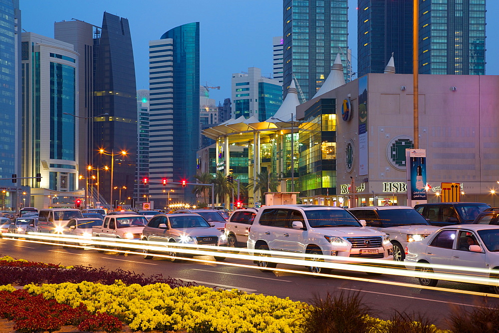 Contemporary architecture and traffic at dusk in the City Centre, Doha, Qatar, Middle East