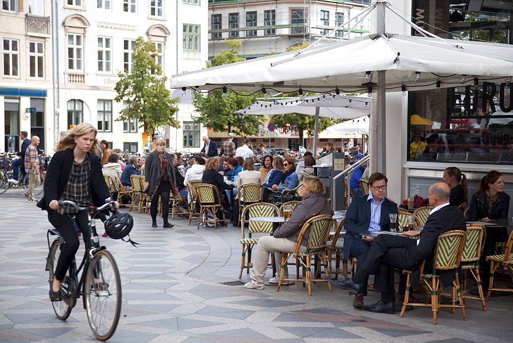 Cafe and cyclist, Copenhagen, Denmark, Scandinavia, Europe