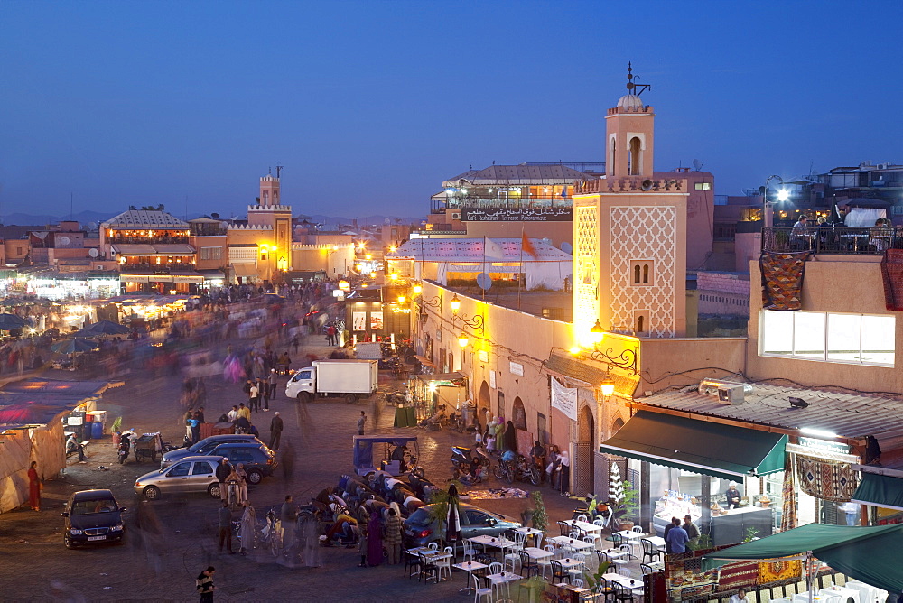 View over market square at dusk, Place Jemaa El Fna, Marrakesh, Morocco, North Africa, Africa