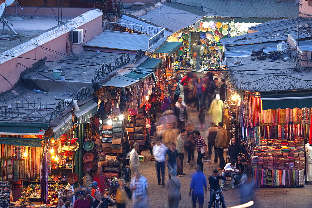 View over market square at dusk, Place Jemaa El Fna, Marrakesh, Morocco, North Africa, Africa