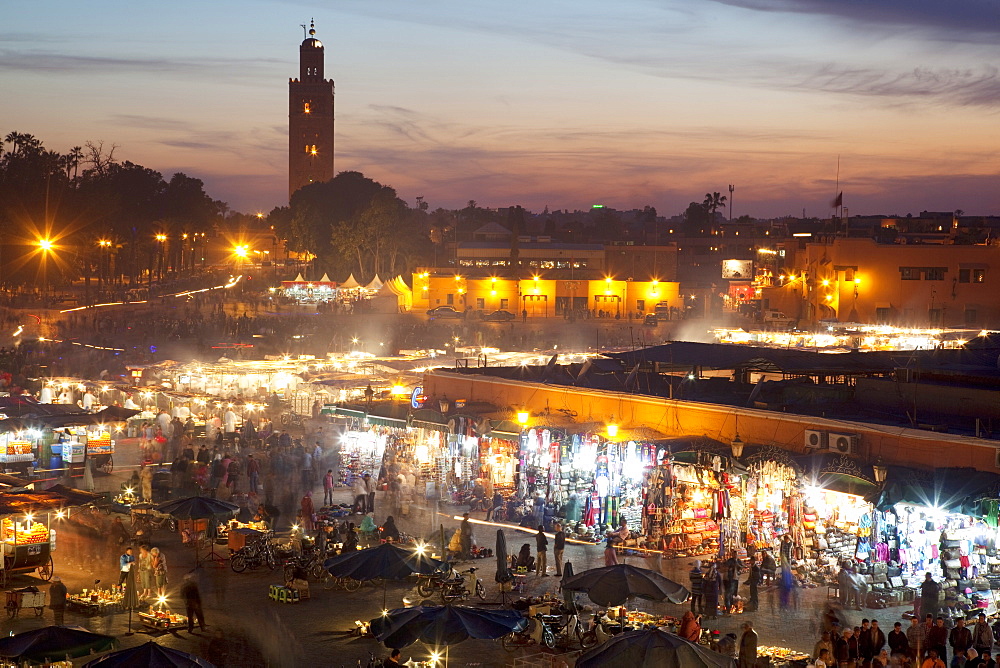 View over market square at dusk, Place Jemaa El Fna, Marrakesh, Morocco, North Africa, Africa