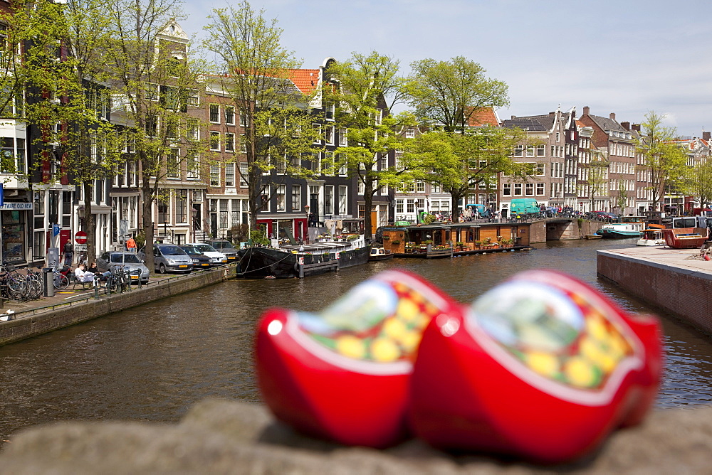 Souvenir clogs and canal, Amsterdam, Holland, Europe