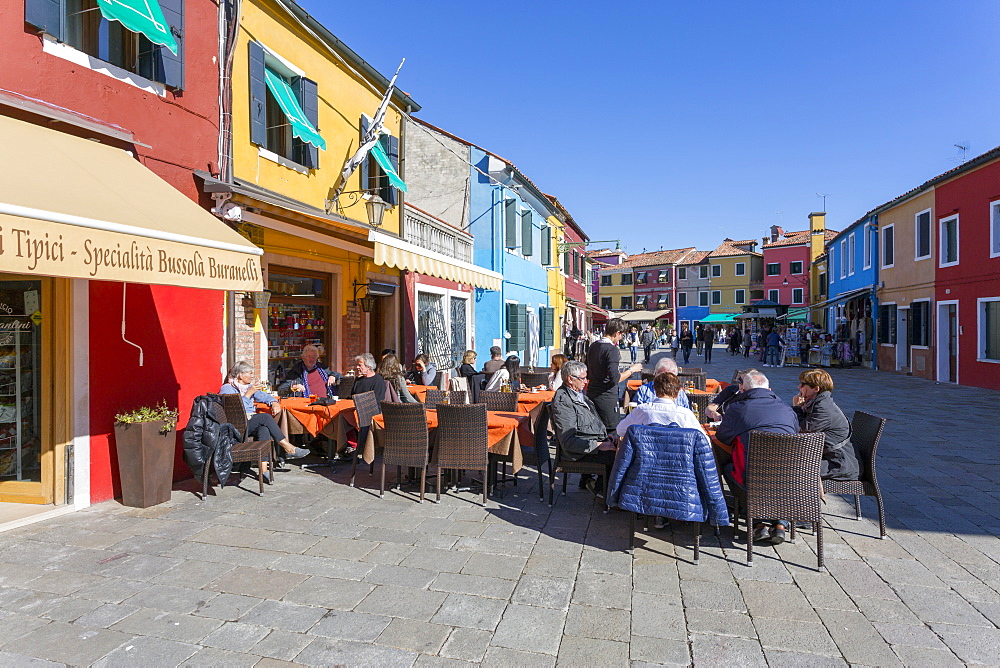 Restaurant and colourful facades, Burano, Veneto, Italy, Europe